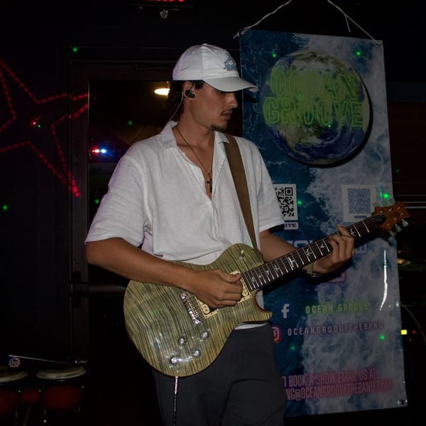 Bradley Martel playing guitar